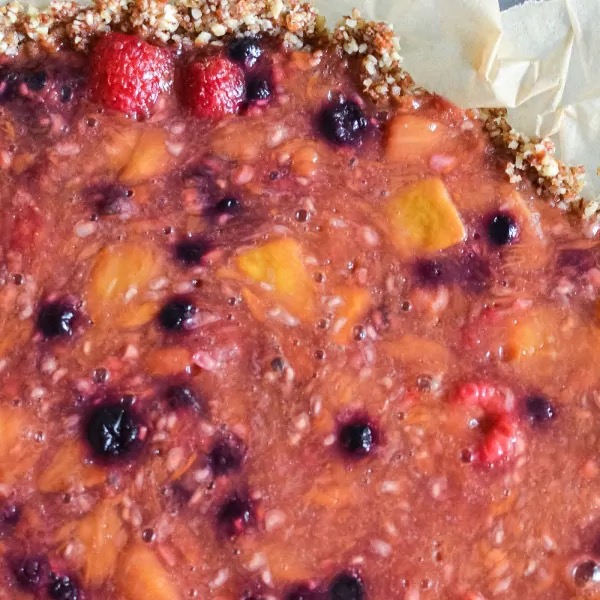 Mango berry pie with raspberries and blueberries